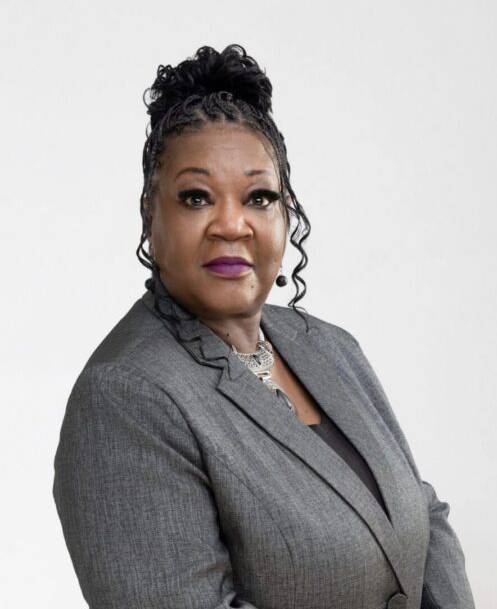 Portrait of professional woman in gray blazer